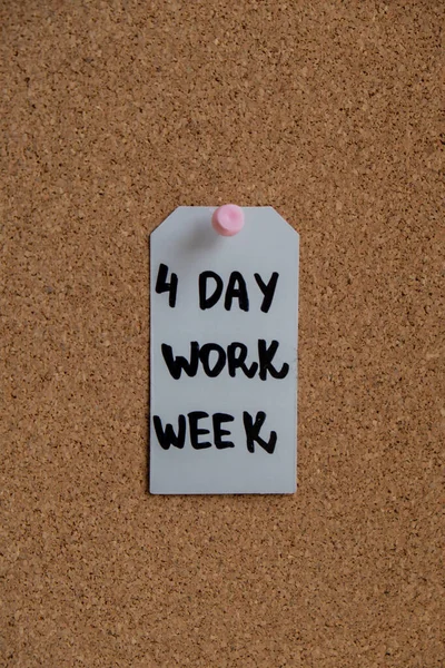 stock image 4 day work week text on paper note pinned to desk four day working week concept. Modern approach doing business short workweek. Effectiveness of employees. Productivity and efficiency days off 