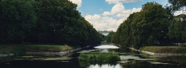 Baths classicist Palace on the Isle in Lazienki Park touristic place in Warsaw. Lazienki Royal Baths Park, Warsaw Poland. Mirror Reflection on the Lake. Nature in summer Baroque columns 