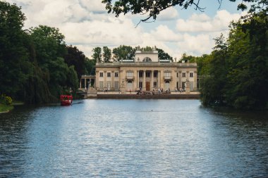 Baths classicist Palace on the Isle in Lazienki Park touristic place in Warsaw. Lazienki Royal Baths Park, Warsaw Poland. Mirror Reflection on the Lake. Nature in summer Baroque columns 