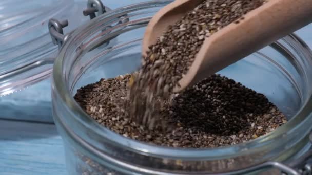 Slow Motion Chia Seeds Fall Glass Jar Healthy Superfood Rich — ストック動画