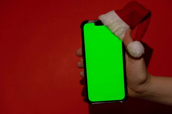 Мобильный Телефон Одетый Красно Белую Шляпу Санта Клауса Хроматическим Экраном — стоковое фото