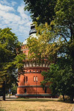 Old brick water tower in Bydgoszcz. The Water Tower in Bydgoszcz, Poland, historic city landmark and viewpoint, Neo-Gothic architecture Poland