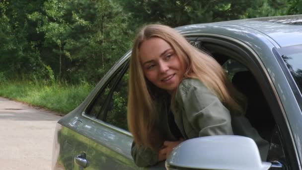Blonde Woman Sticking Head Out Windshield Car Slow Motion Young — Stock Video