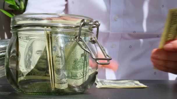 Man Hands Counting Expenses Banknotes Dollar Cash Glass Jar Piggy — Stock Video