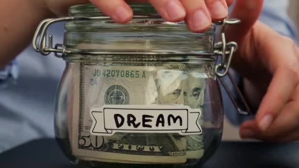 Female Hands Take Money Glass Jar Full American Currency Dollars — Stock Video