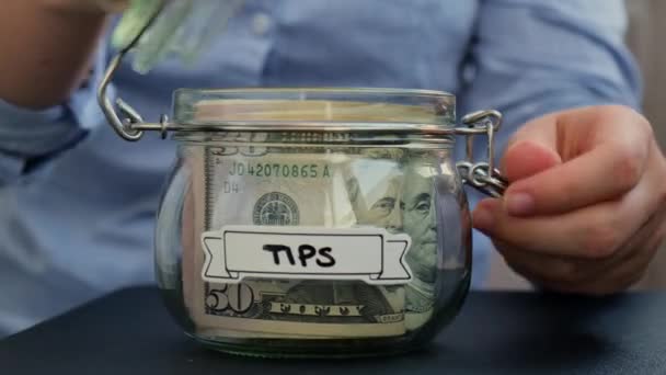 Female Hands Add Money Saving Money Glass Jar Filled Dollars — Stock Video