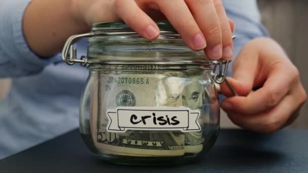 Unrecognizable Woman Add Money Saving Money Glass Jar Filled Dollars — Stock Video