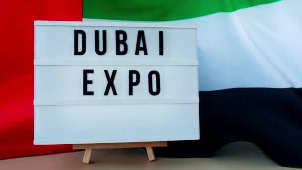 Lightbox Text Dubai Expo Background Waving Uae Flag Made Silk — Stock Video