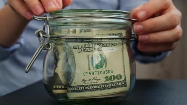 Unrecognizable Woman Turn Saving Money Glass Jar Filled Dollars Banknotes — Stock Video