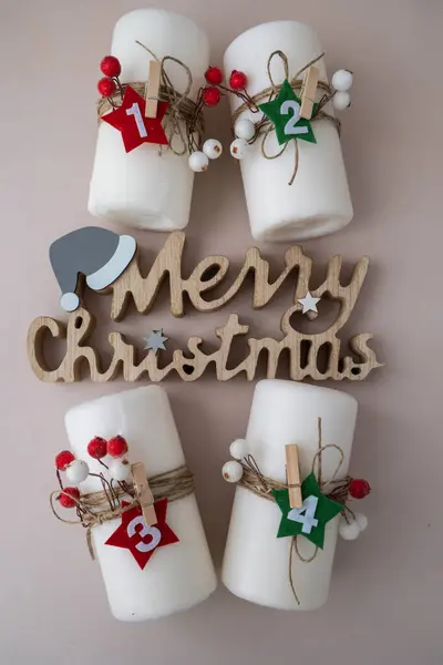 stock image Merry Christmas wooden message New year and Christmas preparation. Four-week advent candles on table. Handmade eco-friendly decor. Sustainable Christmas decoration. Copy space 