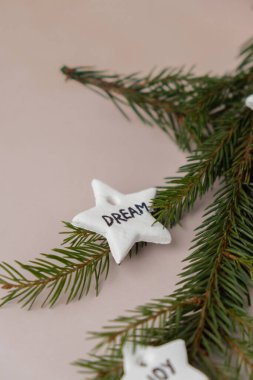 Christmas star with word DREAM White air dry clay for making decor to Christmas tree holiday. Creating hobby recreation activity that involves fingers. DIY crafting Modern art  clipart