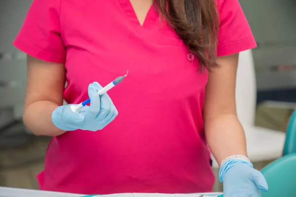 stock image Close up on the hands of a female dentist with a hypodermic syringe