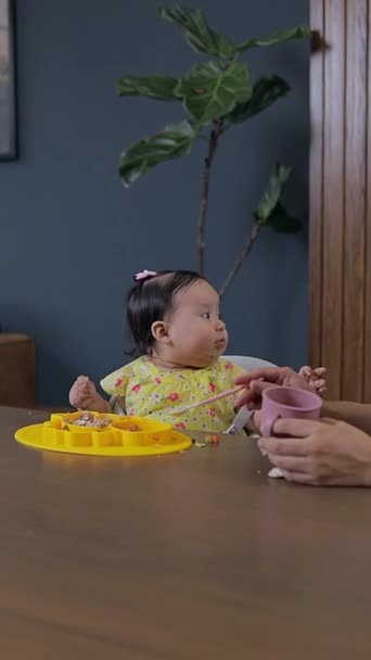 Mom Feeds Her Daughter Solid Food Complementary Feeding Babies Blw — Stock Video