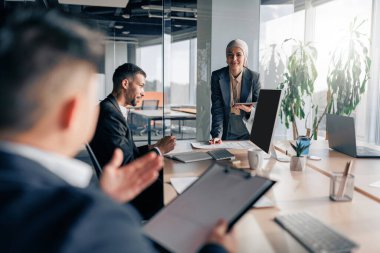 Coworkers cooperating and working together at office meeting, teamwork concept. High quality photo