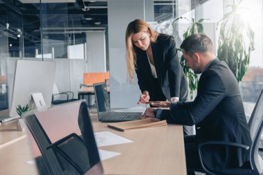 Coworkers cooperating and working together at office meeting, teamwork concept. High quality photo