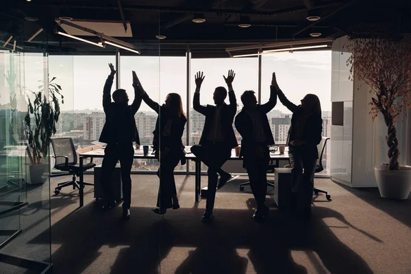 Silhouette Photo Business People Raised Hands While Standing Meeting Room Stock Image