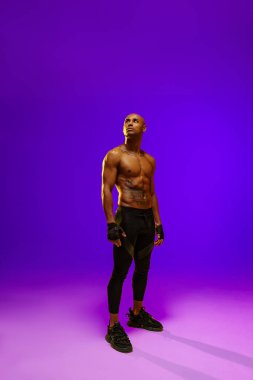 Attractive sporty man with muscled naked body on white studio background. High quality photo