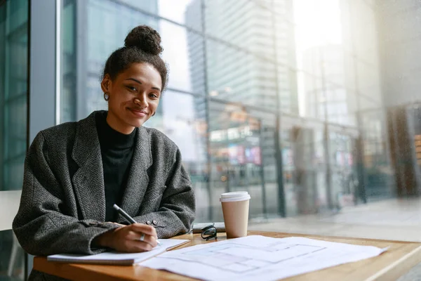 Woman Interior Designer Making Notes While Sitting Cozy Cafe Window — Stok Foto