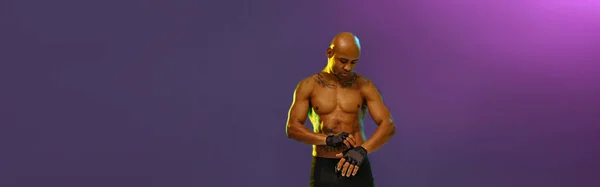 Muscular Man Puts Fighting Gloves Posing Studio Background Color Filter — Stockfoto