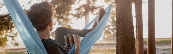 Rear Young Man Traveler Lying Resting Hammock Hot Drink Forest — Stok fotoğraf
