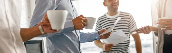 Group Diverse Coworkers Drink Coffee Break Talking Work Blurred Background — Stockfoto