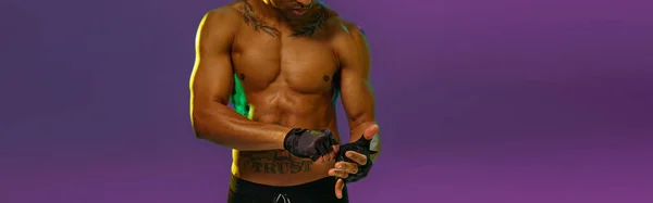 Muscular Man Puts Fighting Gloves Posing Studio Background Color Filter — Stockfoto