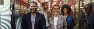 Businesspeople talking while standing in office during break. Teamwork concept. High quality photo