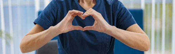 Close Doctor Working Laptop Showing Heart Hands Medical Office High — Stock Photo, Image