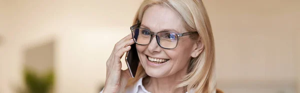 Smiling Mature Woman Blonde Hair Glasses White Shirt Talking Her — Stock Photo, Image