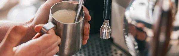 stock image Professional barista warming milk In metal jug with steam of coffee machine. High quality photo