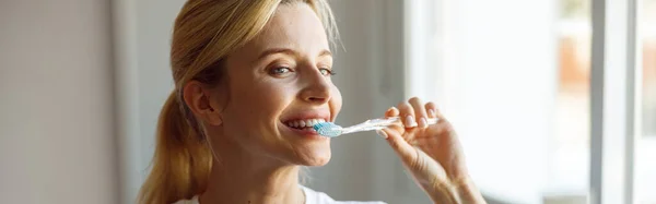 Close Cheerful Young Blonde Female Brushing Teeth Toothbrush Mirror Take — Stock Photo, Image