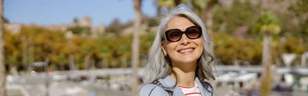 Cheerful Mature Woman Long Gray Hair Looking Camera Smiling While — Stok Foto