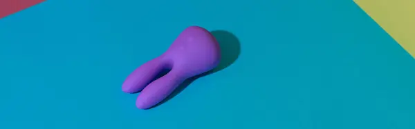 stock image Violet dildo vibrator for clitoris on colored background with contrast shadows. High quality photo