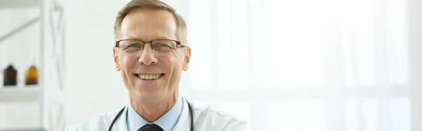 Handsome Man Physician Looking Camera Smiling While Using Modern Notebook — Stock Photo, Image