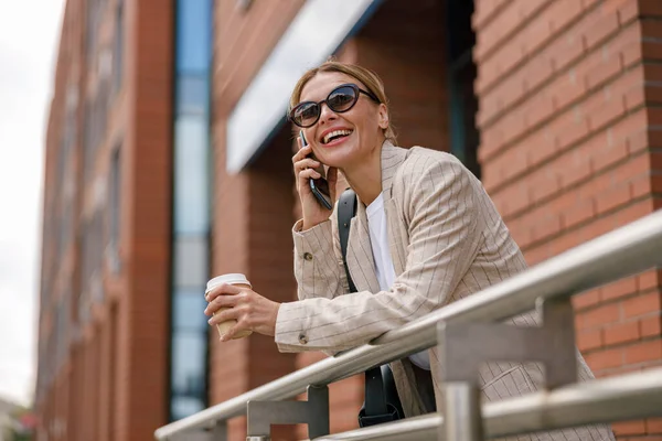 Smiling Woman Office Worker Talking Phone While Standing Modern Building — Stok Foto