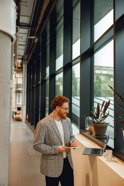 Handsome Male Freelancer Making Notes Working Laptop Standing Coworking — Stok Foto