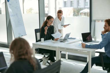 A group of business people partners during a set team meeting in the modern office