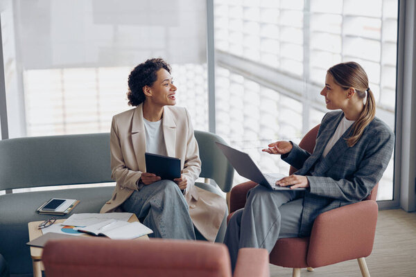 Two Young Female Coworkers Talking Business Meeting Cozy Office Teamwork Stock Picture