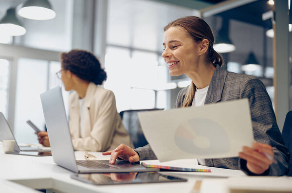 Stylish Female Freelancer Working Documents Use Laptop While Sitting Modern Royalty Free Stock Photos