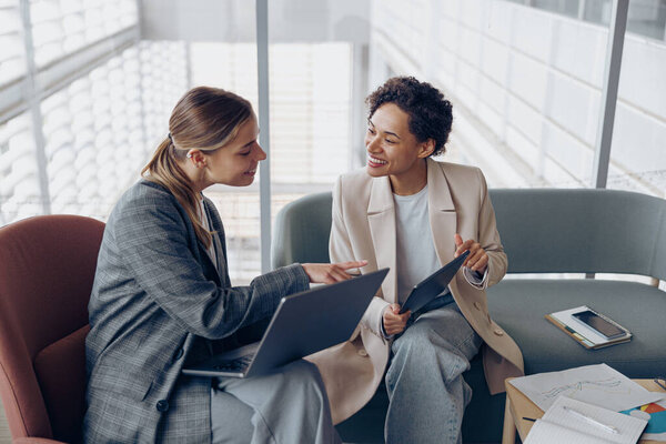 Two Young Female Coworkers Talking Business Meeting Cozy Office Teamwork Royalty Free Stock Images