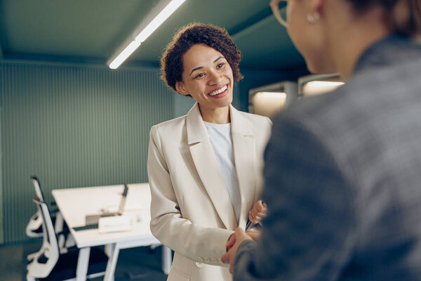 Smiling Female Executive Manager Making Successful Deal Partner Shaking Hand Royalty Free Stock Photos