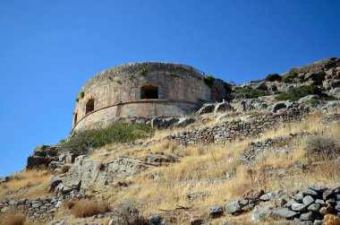 Greece, Crete, buildings built of stone in old Venetian Fortress Spinalonga, until 1957 used as a leper station, now a popular tourist destination