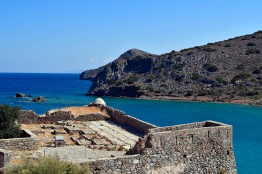 Greece, Crete, old Venetian Fortress Spinalonga, formerly used as a leper station, now a popular tourist destination, the uninhabited Kalydon Peninsula in the background