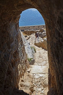 Greece, Crete, tourist in old Venetian Fortress Spinalonga, until 1957 used as a leper station, now a popular tourist destination