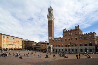 Siena, Italy - September 15, 2009: Unidentified people on  Piazza del Campo - the square for the Palio race - with the Palazzo Pubblico in the UNESCO world heritage site in Tuscany