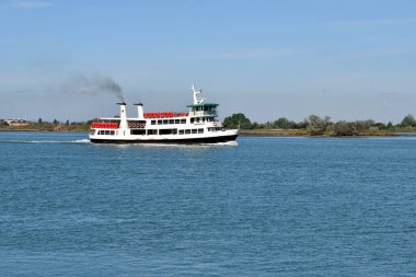 Punta Sabbioni, Italy - April 17, 2024: Water taxi - ferry boat called Vaporetto which are used for public passenger transport between the individual islands of the Venice Lagoon clipart