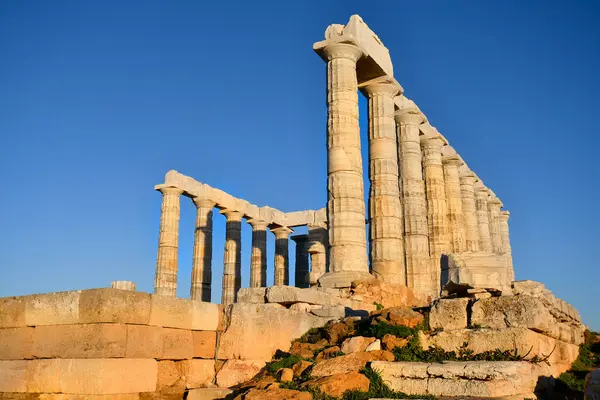 stock image Lavrio, Greece - December 19, 2023: The ancient Temple of Poseidon in the light of the setting sun