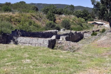 Greece, part of the north wall with drain system in ancient Macedonian site Amphipolis  clipart