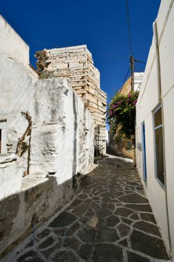 Paros, Greece - September 17, 2024: Cobbled footpath and residential buildings at the medieval Frankish Castle from 13th century in the old town of Parikia clipart