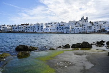 Paros, Greece - September 18, 2024: view to white buildings and the church in Naousa clipart